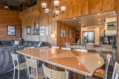 a dining room and kitchen with a table and chairs at Updated 5 Bedroom 3 bathroom townhome Slopeside at 1849 Condos 671 sleeps 10 in Mammoth Lakes