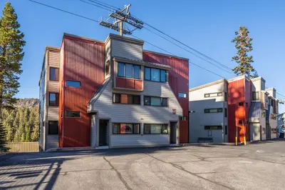an apartment building with a red and silver facade at Updated 5 Bedroom 3 bathroom townhome Slopeside at 1849 Condos 671 sleeps 10 in Mammoth Lakes