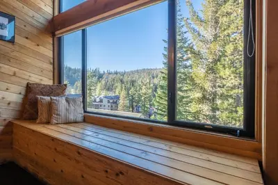 a bench in a room with a large window at Updated 5 Bedroom 3 bathroom townhome Slopeside at 1849 Condos 671 sleeps 10 in Mammoth Lakes