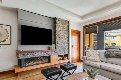 a living room with a tv and a fireplace at Ultimate Luxury Residence with Extras Galore across from Heavenly Village & Gondola - Zalanta Resort in South Lake Tahoe