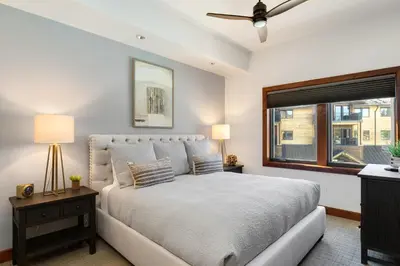 a bedroom with a large bed and a window at Ultimate Luxury Residence with Extras Galore across from Heavenly Village & Gondola - Zalanta Resort in South Lake Tahoe
