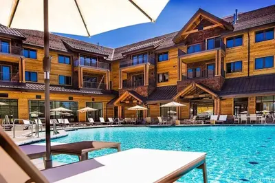 a hotel with a swimming pool in front of a building at Ultimate Luxury Residence with Extras Galore across from Heavenly Village & Gondola - Zalanta Resort in South Lake Tahoe