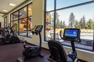 a gym with several exercise bikes and a window at Ultimate Luxury Residence with Extras Galore across from Heavenly Village & Gondola - Zalanta Resort in South Lake Tahoe