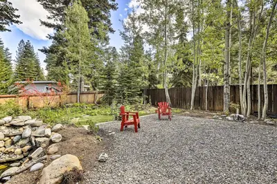 two red chairs sitting in the middle of a yard at 6 Mi to Homewood Mountain Resort Tahoe City Gem! in Tahoe City