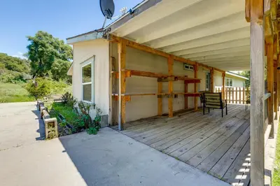 a porch of a house with a bench on it at 33 Mi to Yosemite Secluded Mariposa Retreat! in Mariposa