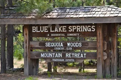 a sign that says blue lake springs and scoliosis woods at Lakeside BLS Retreat near Big Trees & Bear Valley in Arnold