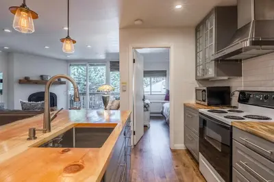 a kitchen with stainless steel appliances and wooden counter tops at Highly updated 1 Bedroom plus den, 2 bath Crestview Unit 5 Sleeps up to 4 located near Canyon Lodge in Mammoth Lakes