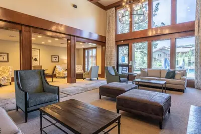 a living room with furniture and a large window at Ski in Ski Out Juniper Springs Lodge #351 Luxury Slope-side 2 Bedrm 2 Bath End Unit! in Mammoth Lakes