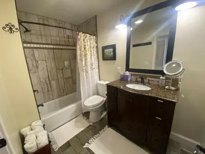 a bathroom with a sink and a toilet and a shower at Historic Washington St Balcony in Sonora