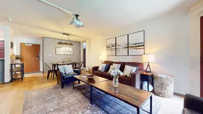 a living room with a couch and a table at Aspen Creek #115 condo in Mammoth Lakes