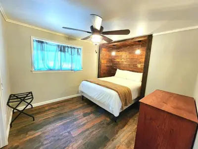 a bedroom with a bed and a ceiling fan at Miners Suite-Centrally Located in Shaver Lake in Shaver Lake