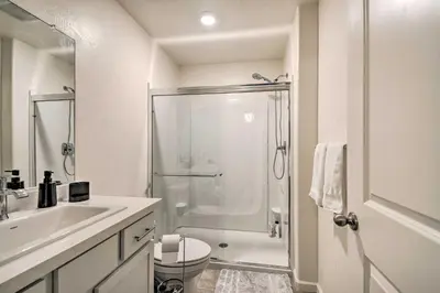 a bathroom with a shower and a toilet and a sink at Contemporary Los Banos Studio Less Than 3 Mi to Dtwn! in Los Banos