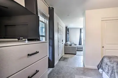 a bedroom with a dresser with a flat screen tv at Contemporary Los Banos Studio Less Than 3 Mi to Dtwn! in Los Banos