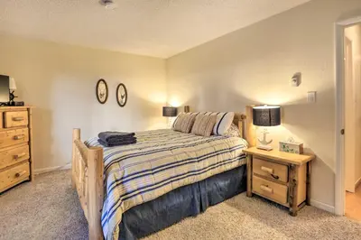 a bedroom with a bed and a nightstand and a bed sidx sidx sidx sidx at 1 Mi to Diamond Peak Skiing Incline Village Condo in Incline Village