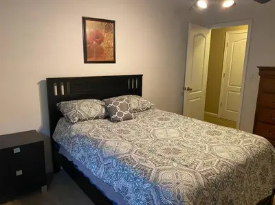 a bedroom with a bed and a picture on the wall at Waxberry Getaway Sequoia/Kings Canyon National Pks in Squaw Valley
