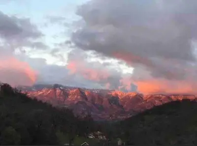 a view of a mountain range with a cloudy sky at Waxberry Getaway Sequoia/Kings Canyon National Pks in Squaw Valley
