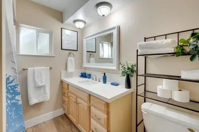 a bathroom with a sink and a mirror at 12 Mi to Apple Hill Family-Friendly Cabin Retreat in Pollock Pines