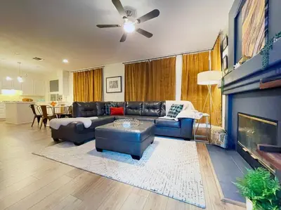 a living room with a couch and a fireplace at King Bed Quiet Home on Cul-de-Sac Hiking Trails in Roseville