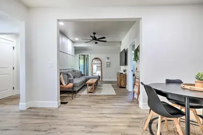 a living room with a table and a couch at Boho-Chic Folsom Retreat Walkable Location! in Folsom
