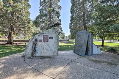 a statue of a man standing in a rock at Boho-Chic Folsom Retreat Walkable Location! in Folsom