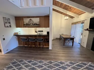 a kitchen and dining room with a table and chairs at 118 Standard home in Mammoth Lakes