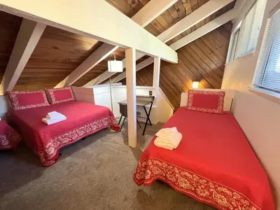 a room with two beds in a attic at 118 Standard home in Mammoth Lakes