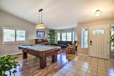 a living room with a pool table at Hot Tub and Fire Pit Reno Gem 12 Mi to Skiing in Reno
