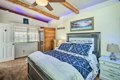 a bedroom with a bed and a ceiling fan at Bethel Island Retreat with Private Boat Slip! in Bethel Island