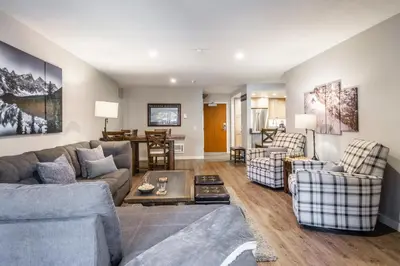 a living room with a couch and chairs and a table at Aspen Creek 121 in Mammoth Lakes