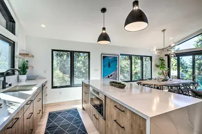 a large kitchen with a large island and windows at Hot Tub! Family Home 7 Mi to Diamond Peak Resort in Kings Beach