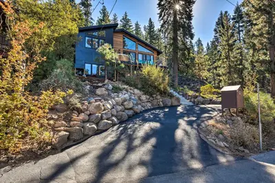 a house in the woods with a stone driveway at Hot Tub! Family Home 7 Mi to Diamond Peak Resort in Kings Beach