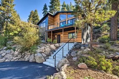 a log home with a staircase leading to it at Hot Tub! Family Home 7 Mi to Diamond Peak Resort in Kings Beach