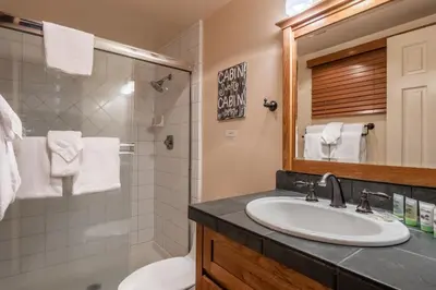 a bathroom with a sink and a shower at Updated 2 Bedroom and Loft 2 Full Bathroom Woodlands #51Just Steps to Shuttle Close to Golf Course in Mammoth Lakes