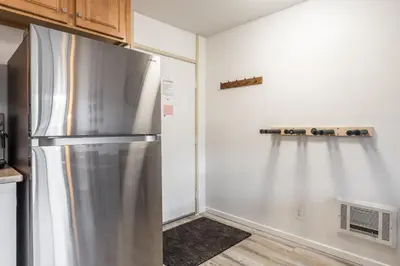 a kitchen with a stainless steel refrigerator at Summit #256 - Top Floor Summit 1 Bedrm 1 Bathrm Condo Just steps too Little Eagle Lodge Sleeps 4 in Mammoth Lakes