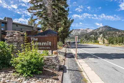 a sign for the summit apartments on the side of a road at Summit #256 - Top Floor Summit 1 Bedrm 1 Bathrm Condo Just steps too Little Eagle Lodge Sleeps 4 in Mammoth Lakes