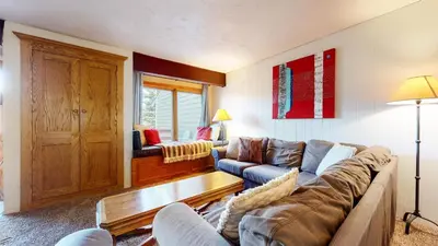 a living room with a couch and a table at Lakeview Villas #28 condo in Mammoth Lakes