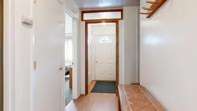 a hallway with a white door and a window at Lakeview Villas #28 condo in Mammoth Lakes