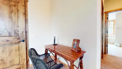 a wooden desk in a room with two chairs at Graystone #2024 home in Mammoth Lakes