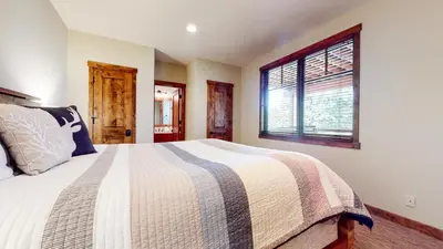 a bedroom with a bed and a window at Graystone #2024 home in Mammoth Lakes