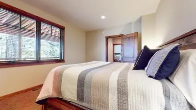 a bedroom with a bed and a window at Graystone #2024 home in Mammoth Lakes