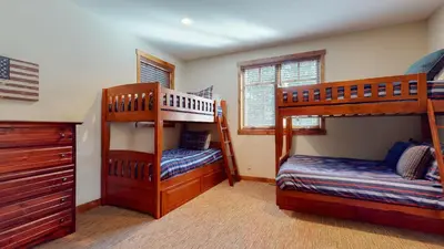 a bedroom with two bunk beds in a house at Graystone #2024 home in Mammoth Lakes