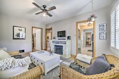 a living room with a couch and a fireplace at Hot Tub and Walk to Midtown! Reno Retreat in Reno