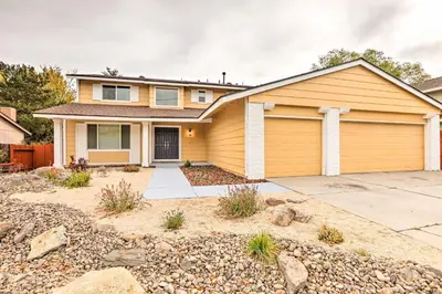 a house with a garage at Relax Fireside and Play Pool! Home 4 Mi to Dtwn Reno in Reno