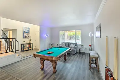 a living room with a pool table in it at Relax Fireside and Play Pool! Home 4 Mi to Dtwn Reno in Reno