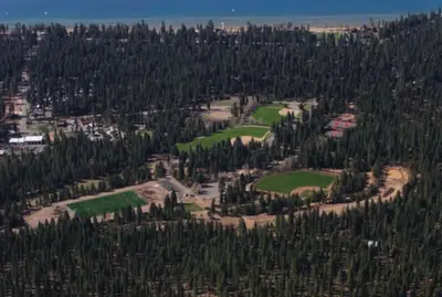 an aerial view of a golf course with trees at Kings Beach Cozy in Kings Beach