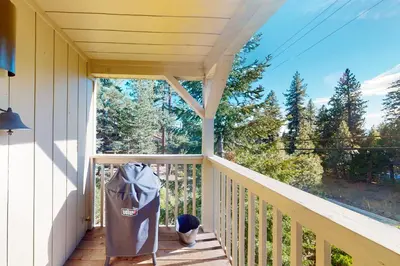 a porch with a trash can on the side at Kings Beach Cozy in Kings Beach