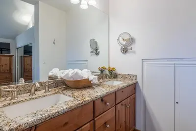 a bathroom with two sinks and a mirror at Updated 3 Bedroom 3 Bathroom Snowcreek Phase V #884, Sleeps 6 in Mammoth Lakes