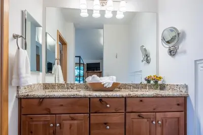 a bathroom with a sink and a large mirror at Updated 3 Bedroom 3 Bathroom Snowcreek Phase V #884, Sleeps 6 in Mammoth Lakes