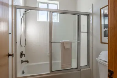 a bathroom with a shower with a glass door at Updated 3 Bedroom 3 Bathroom Snowcreek Phase V #884, Sleeps 6 in Mammoth Lakes