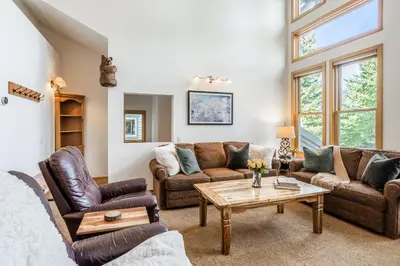 a living room with couches and a coffee table at Updated 3 Bedroom 3 Bathroom Snowcreek Phase V #884, Sleeps 6 in Mammoth Lakes